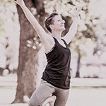 Lou practising yoga in a  park.